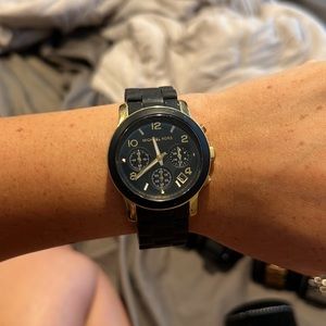 Black and gold Michael kors watch